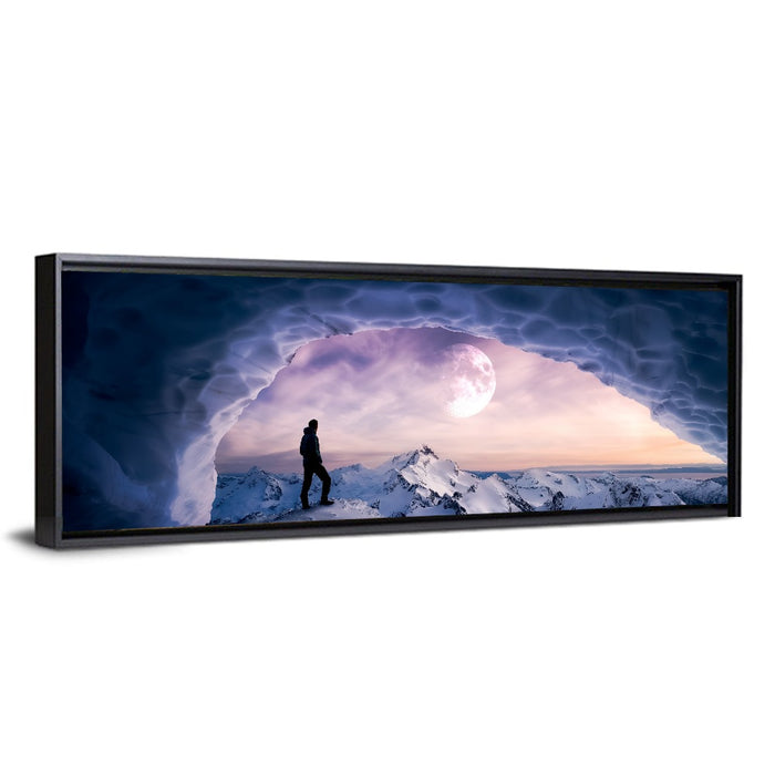 Moonlit Ice Cave Hiker Wall Art as a framed canvas