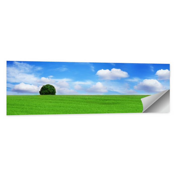 Solitary Tree Over Green Meadow Wall Art as a poster print