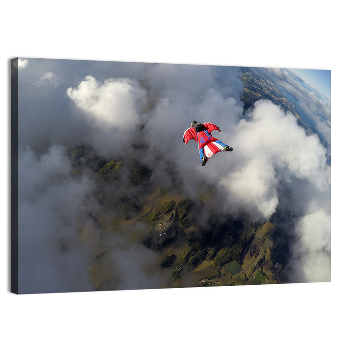 Red Wingsuit Skydiver Over Clouds Wall Art as a canvas print