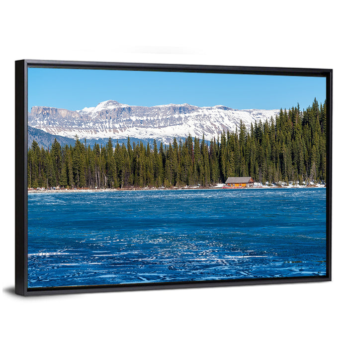 Boathouse on Frozen Lake Louise Wall Art as a framed canvas