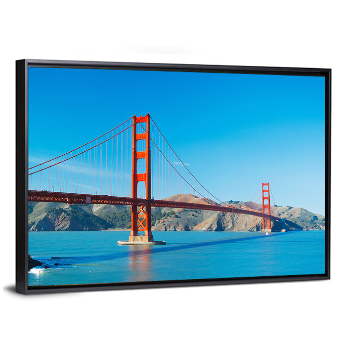 Golden Gate Bridge Under Blue Sky Wall Art as a framed canvas