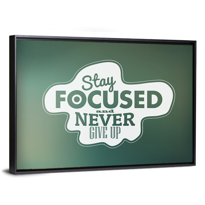Stay Focused Never Give Up Typography Wall Art as a framed canvas