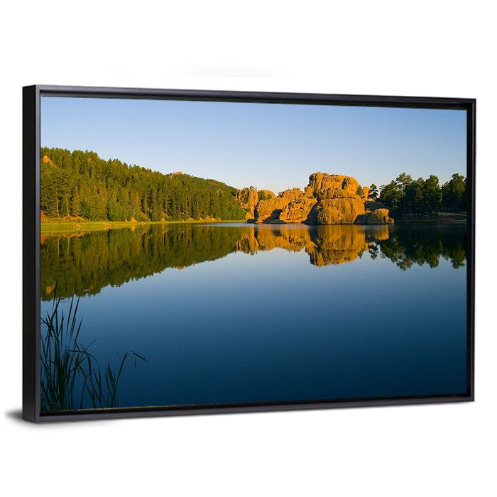 Sylvan Lake Golden Hour Reflection Wall Art as a framed canvas