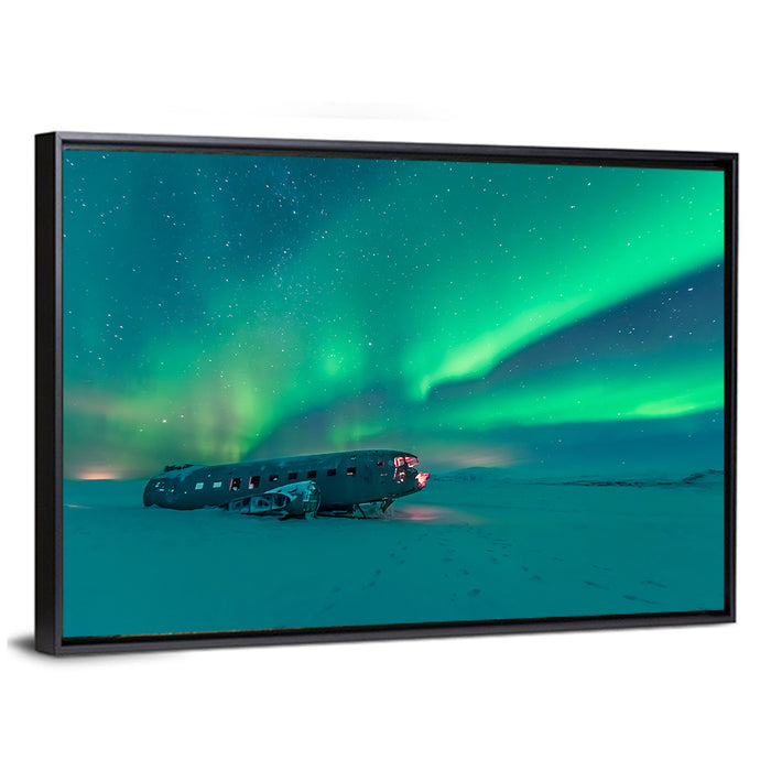 Northern Lights Over Sólheimasandur Wreck Wall Art as a framed canvas