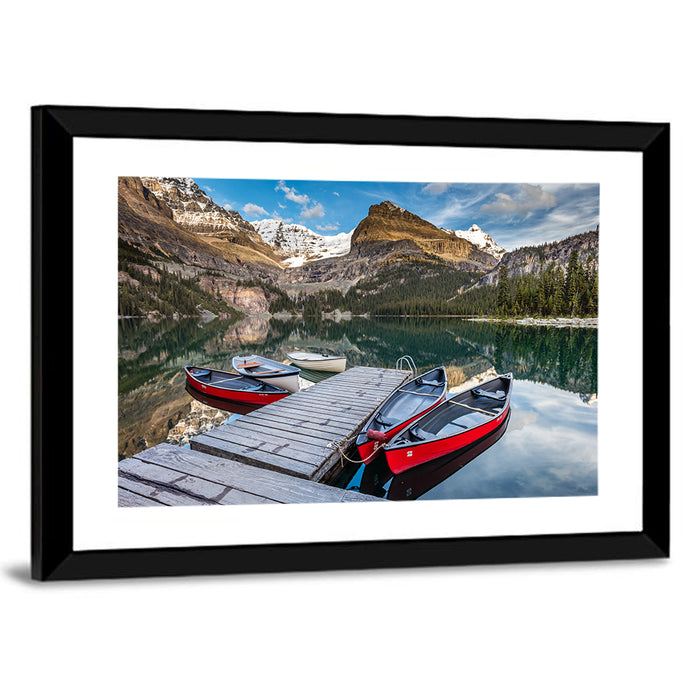 Canadian Rockies Lake with Red Canoes Wall Art as a framed print