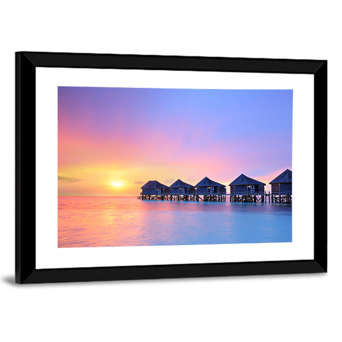 Maldives Sunset Over Water Bungalows Wall Art as a framed print