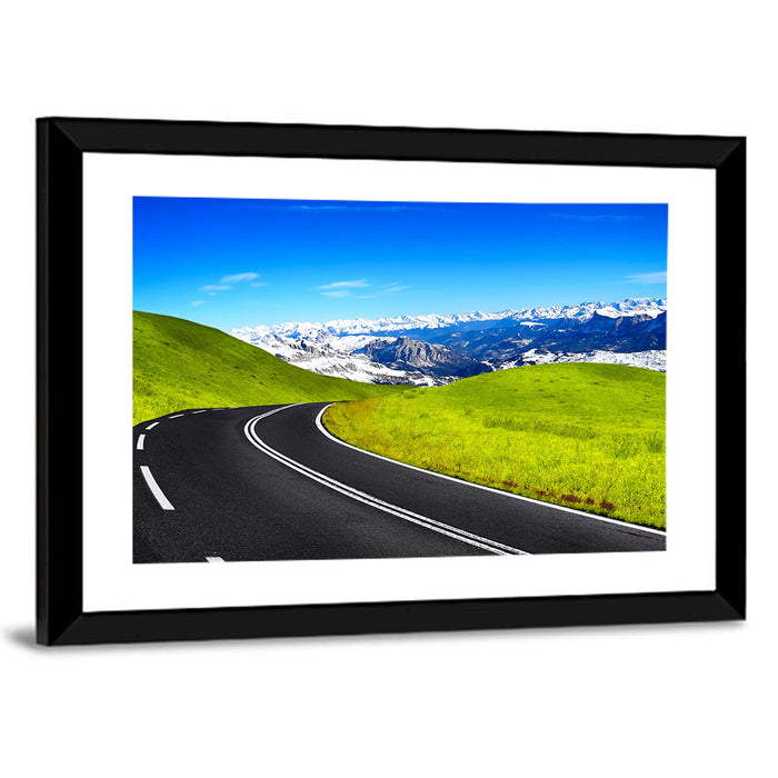 Winding Road Through Snow-capped Mountains Wall Art as a framed print