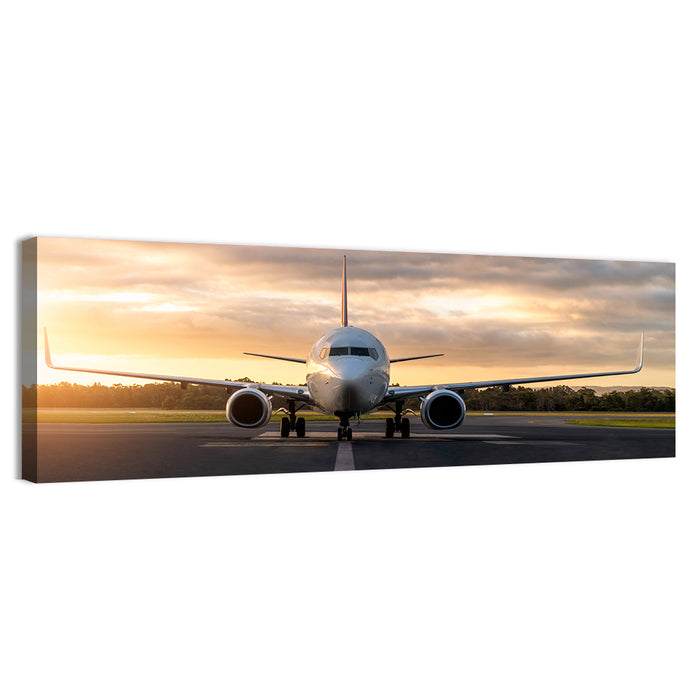 Front Facing Airplane on Runway at Sunset Wall Art as a canvas print