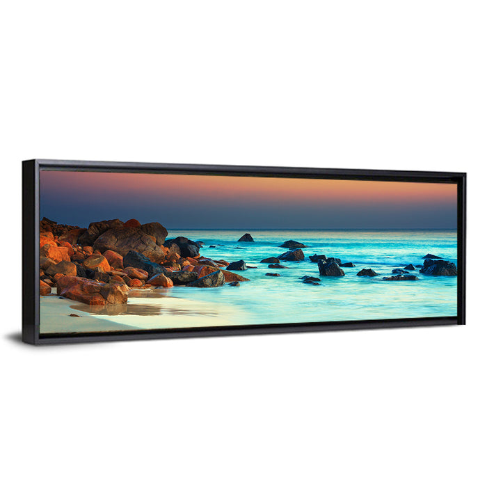 Sunset Over Volcanic Shoreline Wall Art as a framed canvas