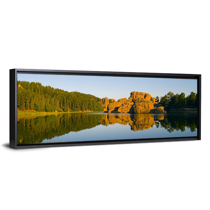 Sylvan Lake Golden Hour Reflection Wall Art as a framed canvas