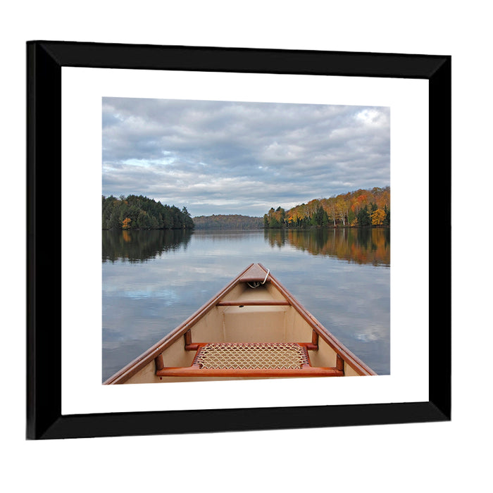 Overcast Canoe Bow on Autumn Lake Wall Art as a framed print