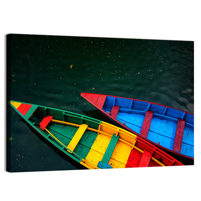 Two Colorful Boats Over Rippling Water Wall Art as a canvas print