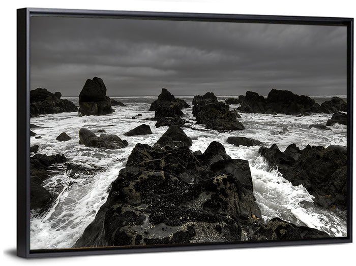 Moody Black and White Rocky Coast Waves Wall Art as a framed canvas