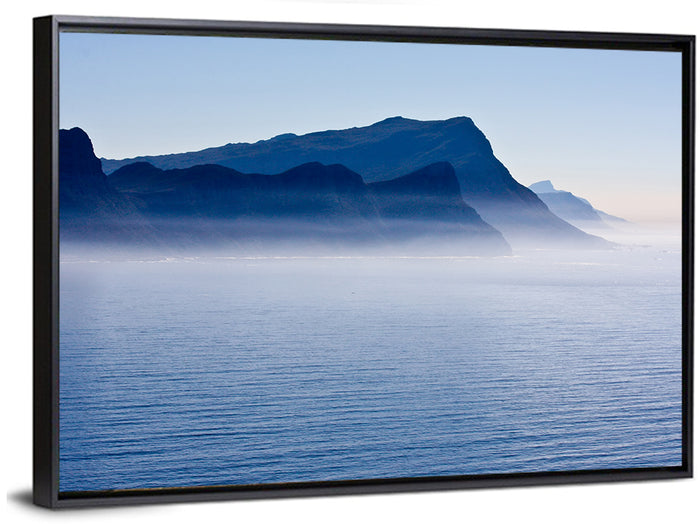Misty Coastal Cliffs and Mountain Layers Wall Art as a framed canvas