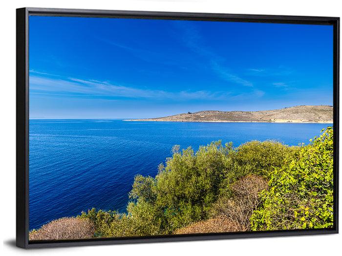 Sunlit Albanian Coastline Wall Art as a framed canvas