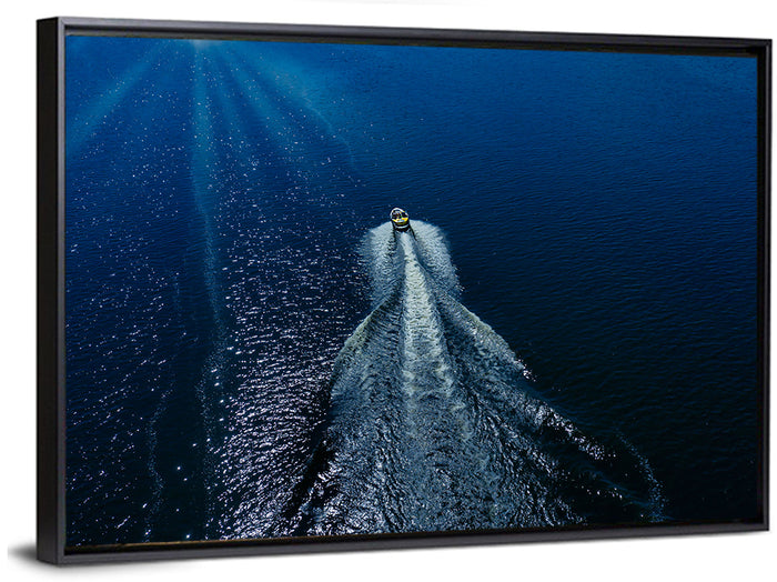 Aerial Boat Over Deep Blue Water Wall Art as a framed canvas