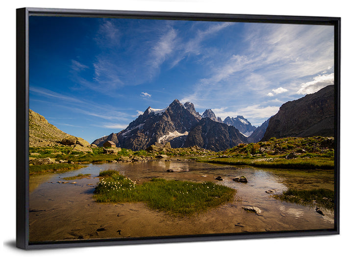 La Meije Alpine Lake and Stone Hut Wall Art as a framed canvas