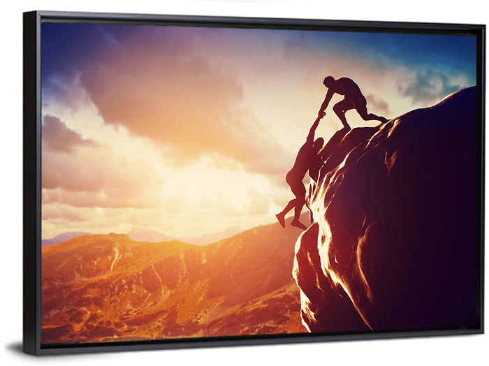 Two Hikers Summit Assist at Sunset Wall Art as a framed canvas