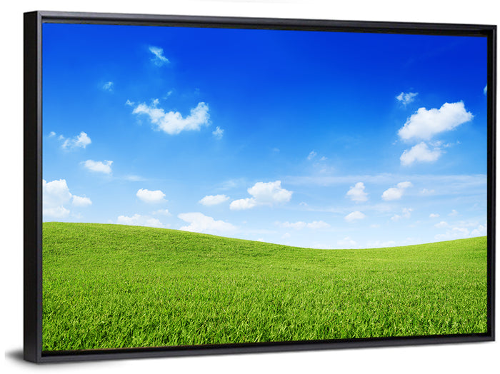 Rolling Green Meadow Under Blue Sky Wall Art as a framed canvas