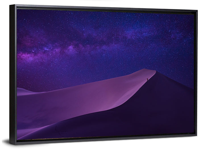 Lone Hiker Under the Milky Way Wall Art as a framed canvas