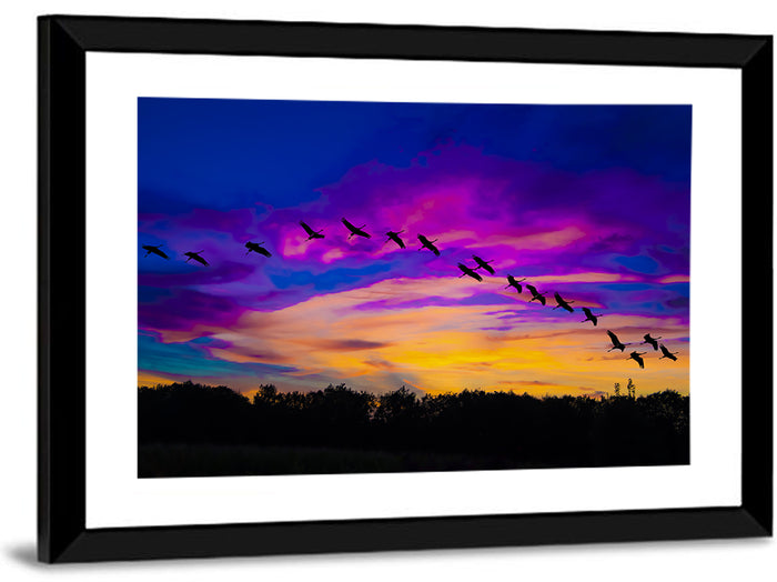 Silhouetted Cranes at Dusk Wall Art as a framed print