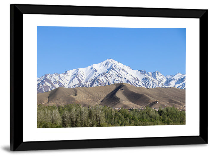 Afghan Snow-capped Peaks Above Forested Foothills Wall Art as a framed print