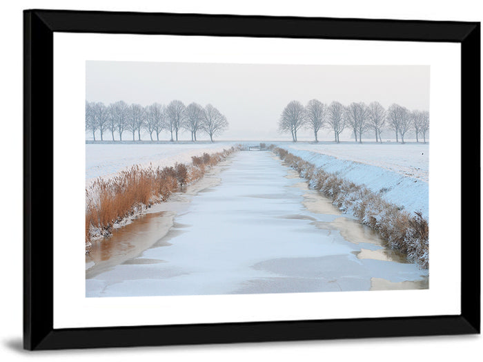 Frozen Canal with Bare Trees Wall Art as a framed print