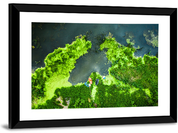 Green Algae Lake with Boats Wall Art as a framed print