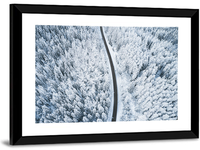 Winding Snow-covered Forest Road Wall Art as a framed print