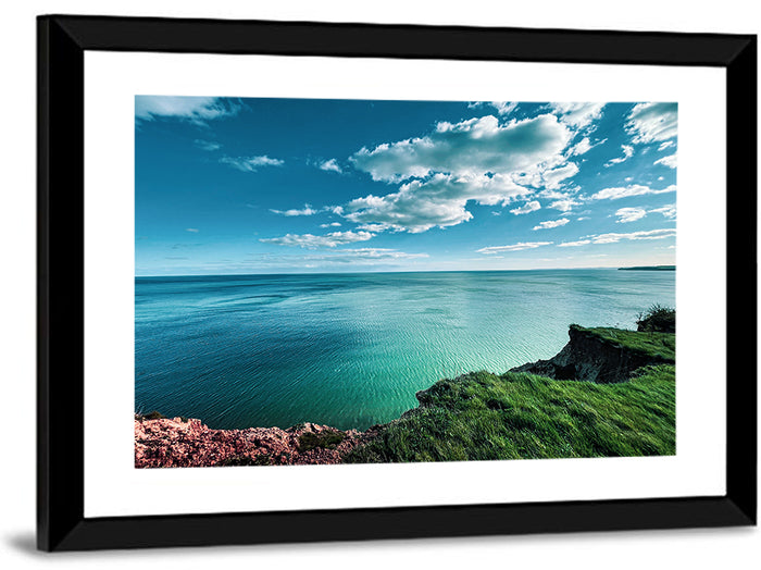 Coastal Cliffs Above a Turquoise Sea Wall Art as a framed print