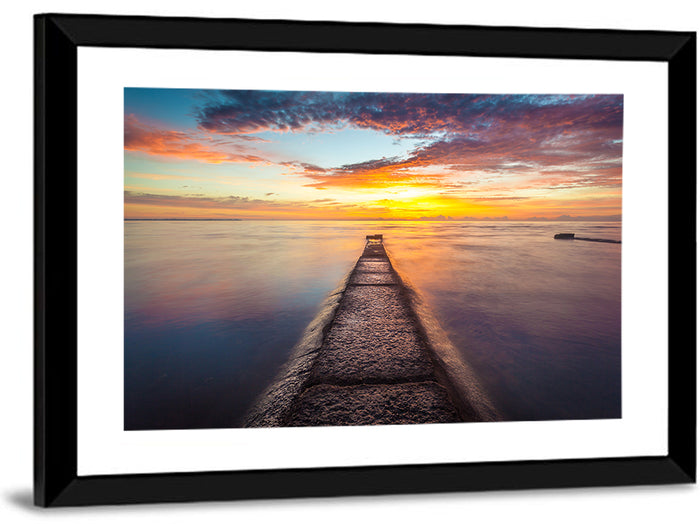 Stone Pier to Glowing Horizon Wall Art as a framed print