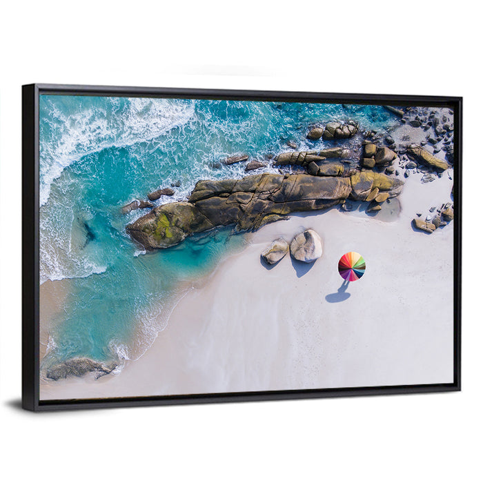 Aerial Beach with Rainbow Umbrella Wall Art as a framed canvas