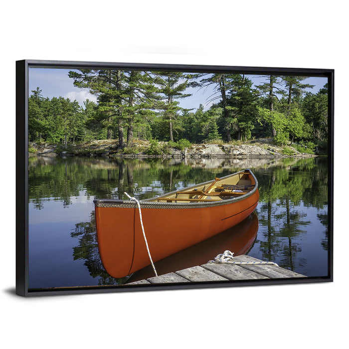 Orange Canoe on Ontario Lake Wall Art as a framed canvas