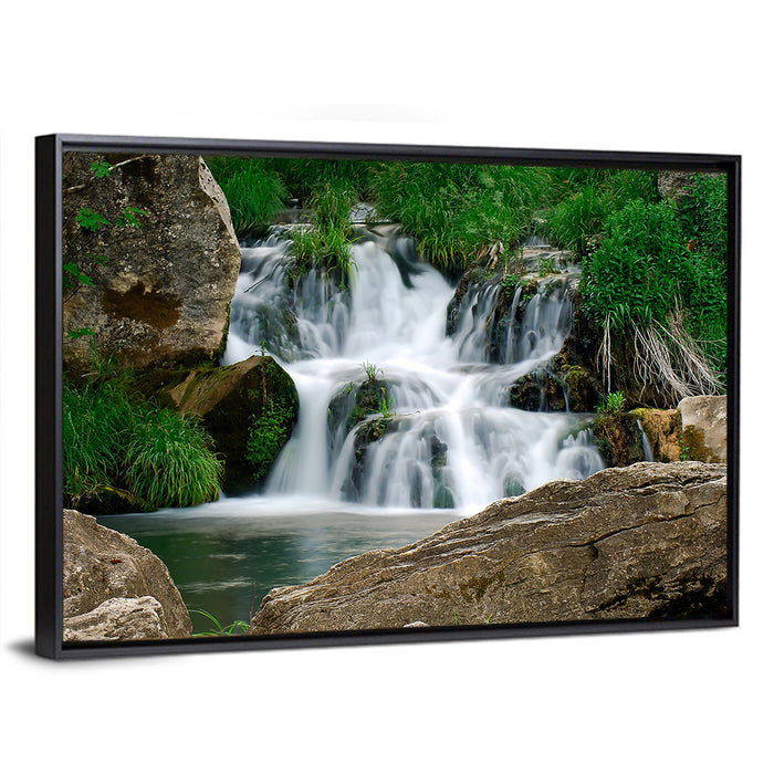 Moss Covered Rocky Waterfall Wall Art as a framed canvas