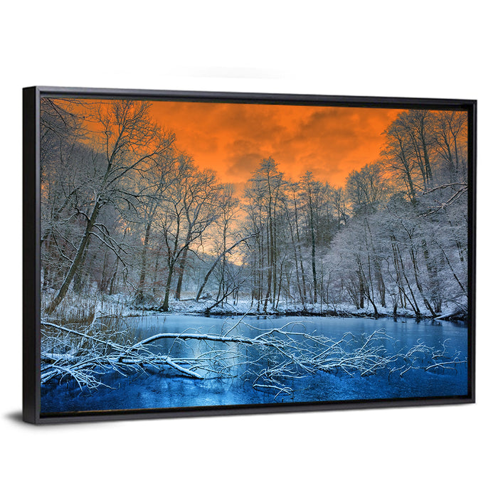 Sunset Over Winter Forest Lake Wall Art as a framed canvas