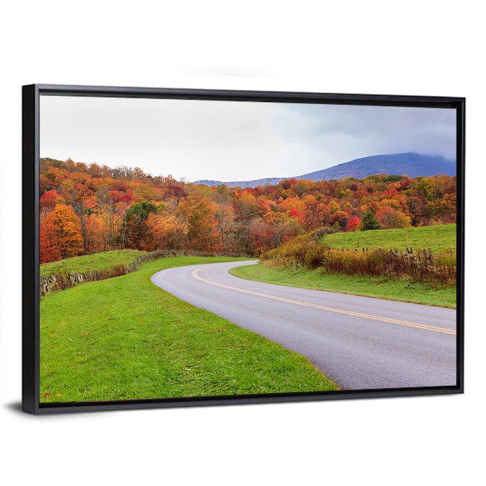 Curving Road Through Autumn Meadow Wall Art as a framed canvas