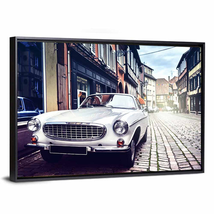 Vintage Car on Cobblestone Street Wall Art as a framed canvas