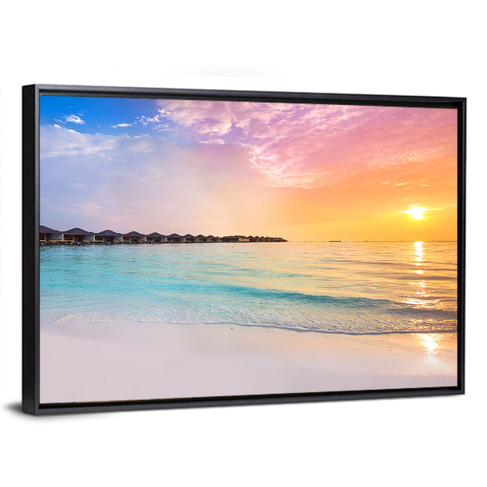 Overwater Bungalows at Sunset Wall Art as a framed canvas