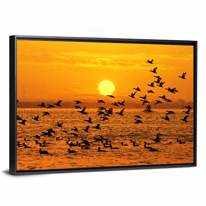 Golden Flock at Sunset Wall Art as a framed canvas