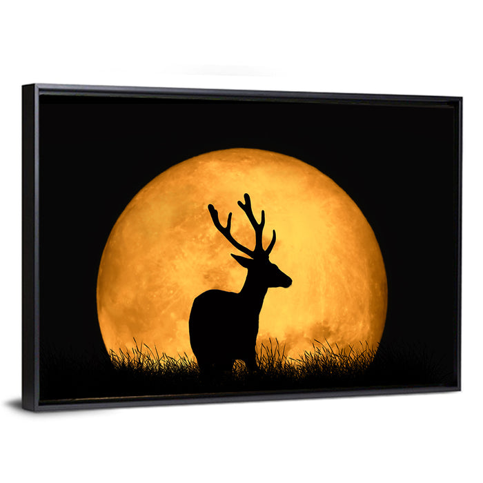 Buck Silhouette Under Red Moon Wall Art as a framed canvas