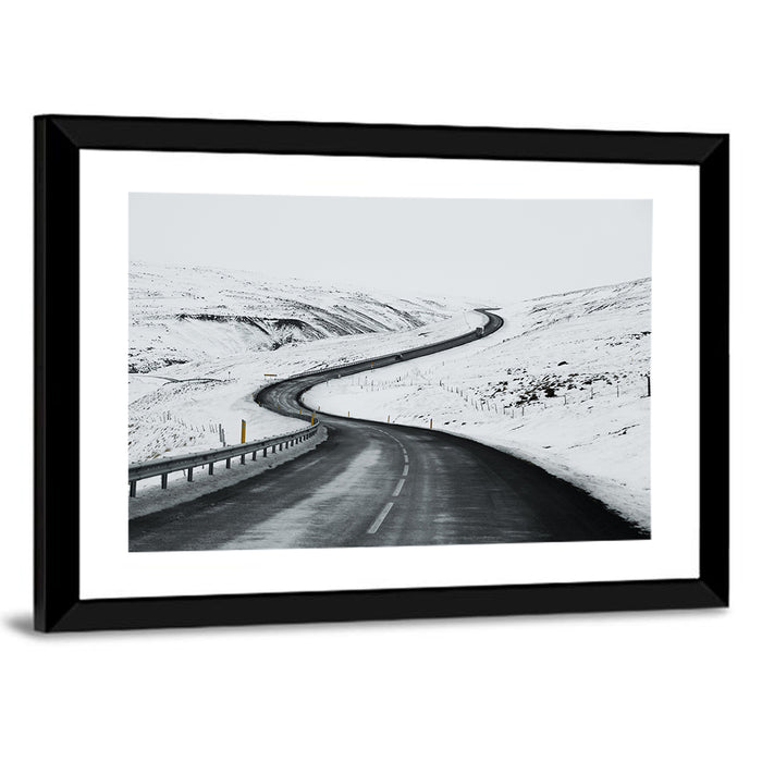 Winding Snow Road with Yellow Markers Wall Art as a framed print