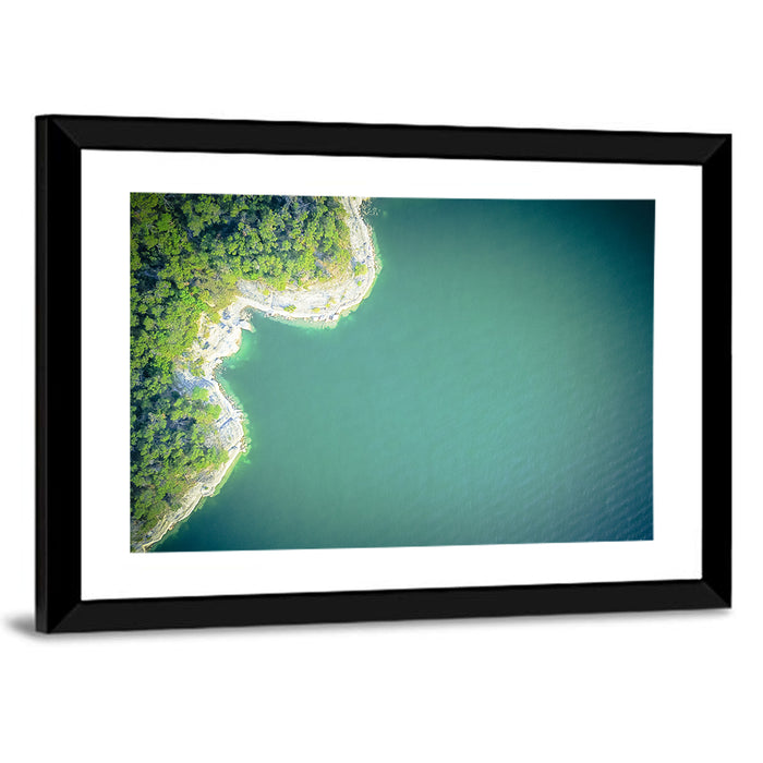 L-shaped Coastline Over Teal Lake Wall Art as a framed print