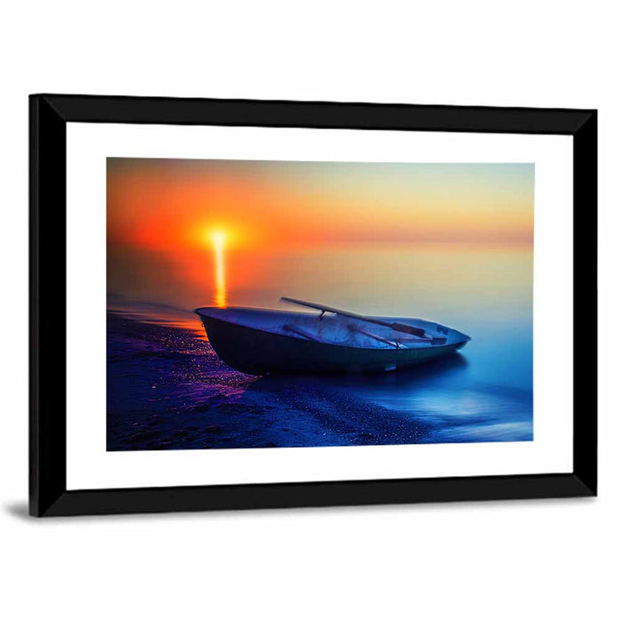 Rowboat on Sandy Shore at Sunset Wall Art as a framed print