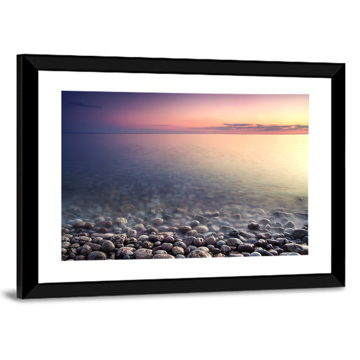 Pebbled Shore Sunset Wall Art as a framed print