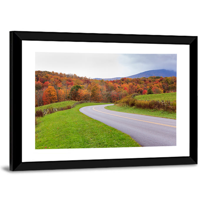 Curving Road Through Autumn Meadow Wall Art as a framed print