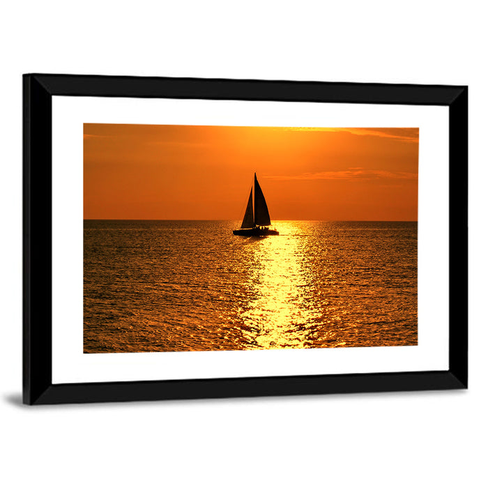 Sailboat Silhouette at Golden Sunset Wall Art as a framed print