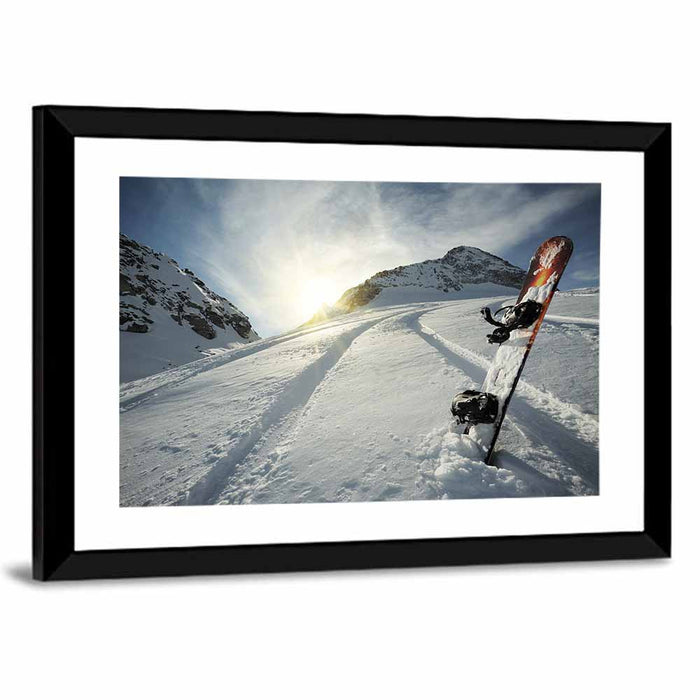 Snowboard on Snow-covered Mountain Slope Wall Art as a framed print