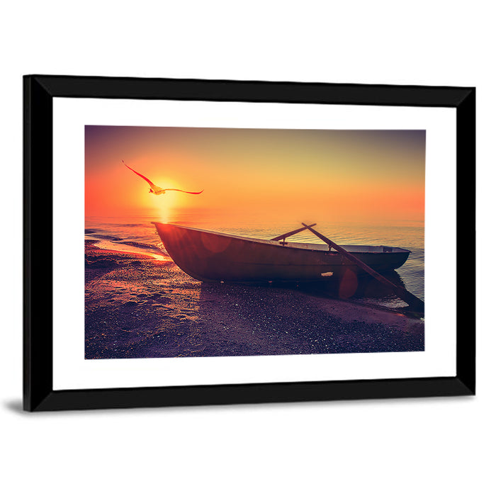 Sunset Rowboat on Sandy Shore Wall Art as a framed print