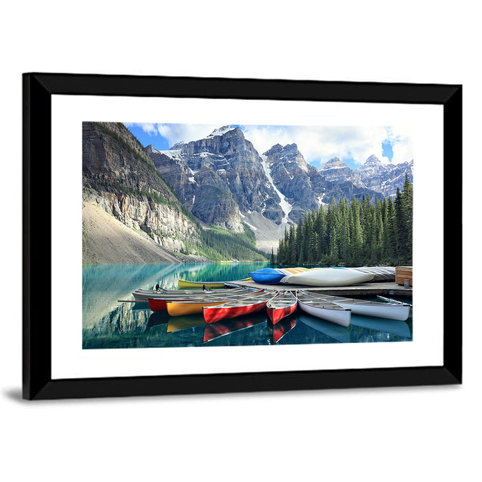 Moraine Lake Canoes at Lake Louise Wall Art as a framed print