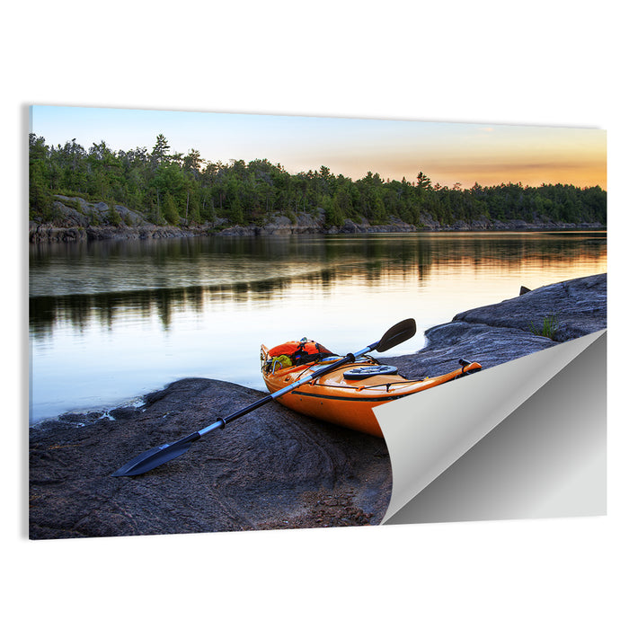 Orange Kayak on Rocky Shore Wall Art as a poster print